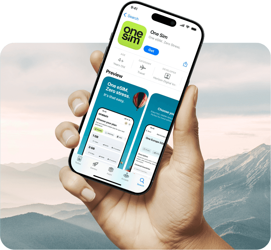 Hand holding phone displaying onesim™ app in app store